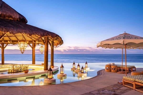 Luxury resort infinity pool — click to redeem your Condo voucher
